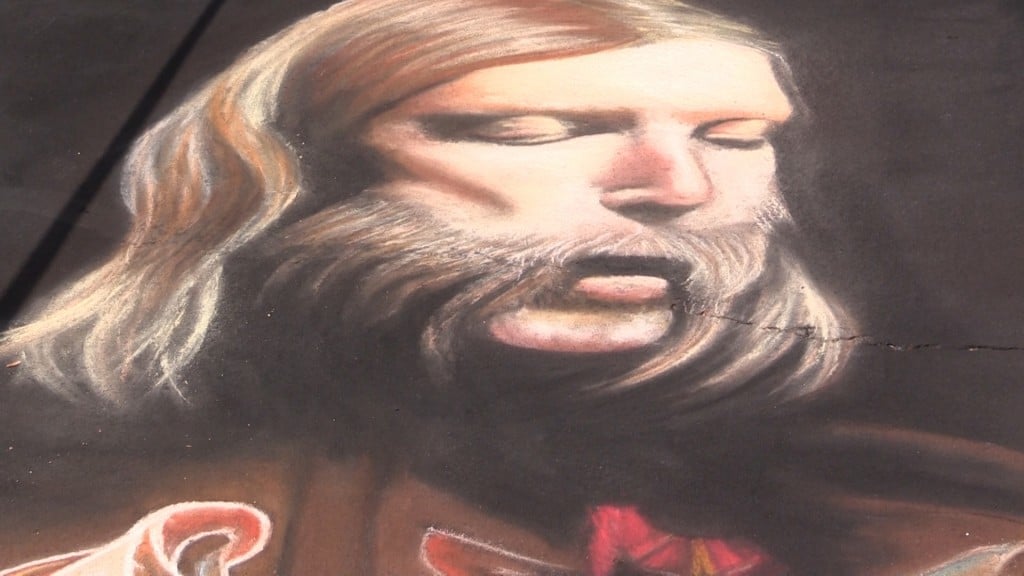 Andrew Patrick Henry joins multiple artists to draw elaborate chalk art throughout Macon.