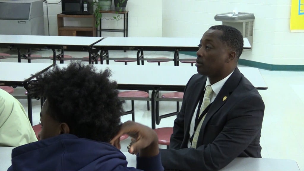 Chief Tim Chatman of the Dublin Police Department teachers his Transformers program to teens at Moore Street School Tuesday.