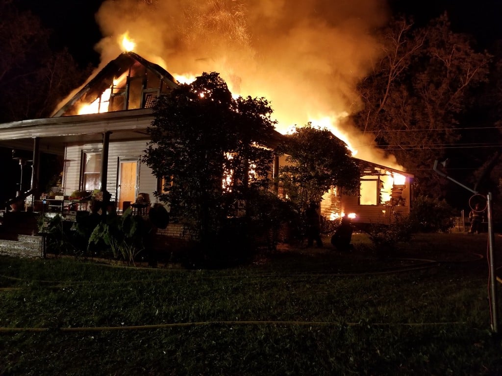 Armed man rescued from burning home in Macon