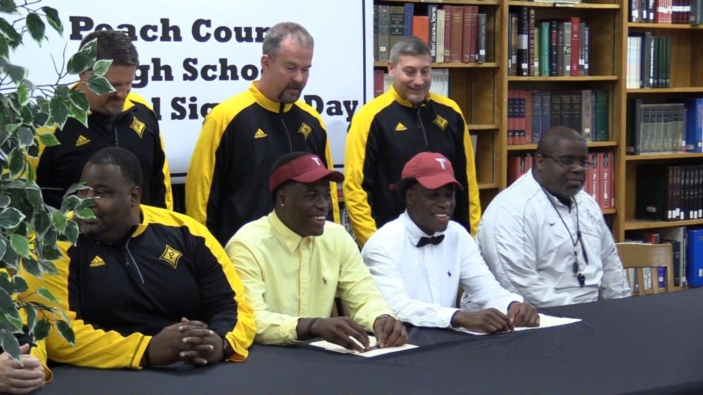 Peach County players Kevin and Kyle Nixon signed to play football at Troy University in the fall.