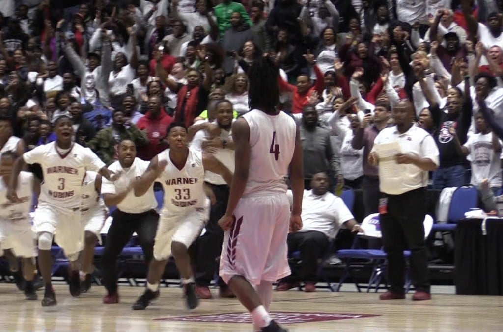 Warner Robins celebrates after Jacolbey Owens' go-ahead three pointer with 1.3 seconds remaining in the GHSA AAAAA title game Thursday at the Macon Centreplex.