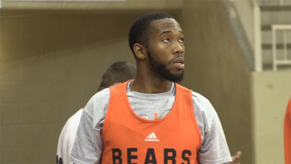 Bryan is seen at a Mercer basketball practice in December