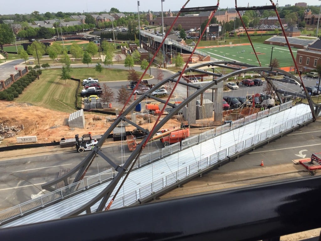 A bridge connecting The Lofts at Mercer to campus was lifted into place Wednesday morning.