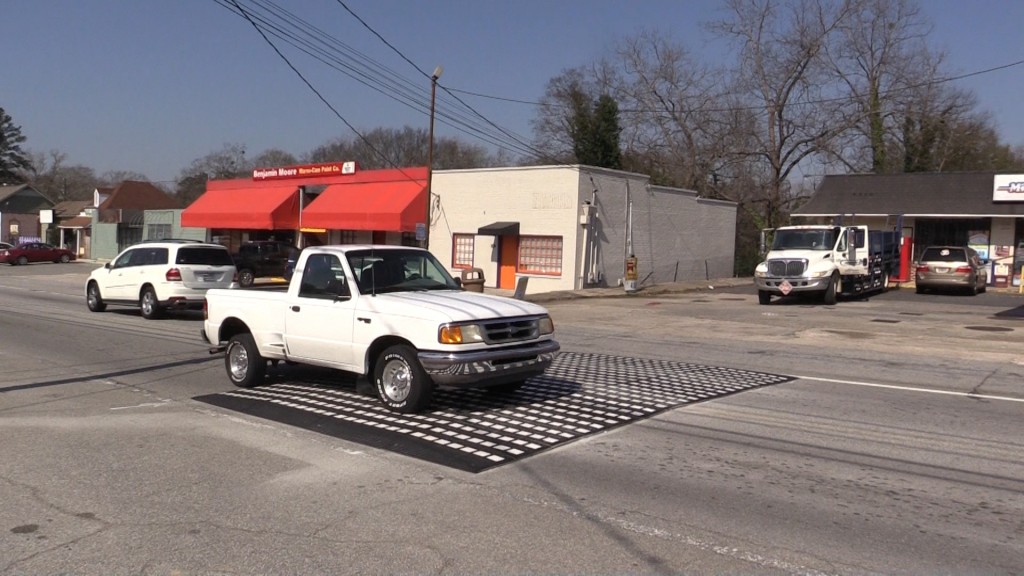 Speed table encourages drivers to slow down.
