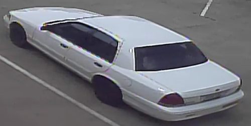 White Ford Crown Victoria used in an armed robbery.