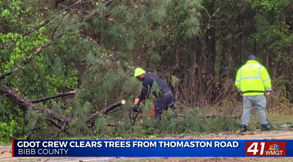 Georgia Department of Transportation crews clear fallen trees from Thomaston Road at Price Road in Bibb County after Middle Georgia storm damage