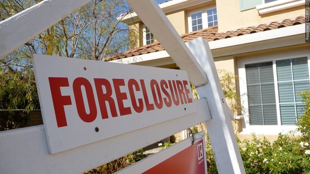 Foreclosure sign in front of a home
