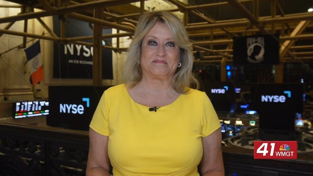 Morning Business Report: Stocks Slide As Iran Tensions Grow And States Challenge Media Merger