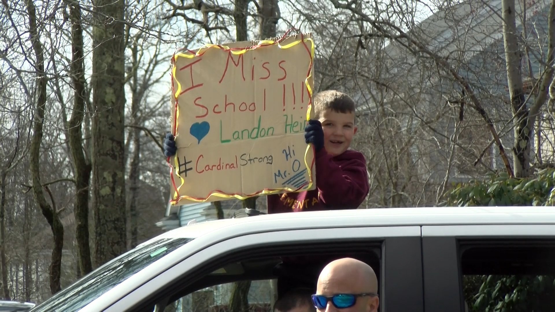 Swansea teachers wave hello to students in drive-by parade | ABC6