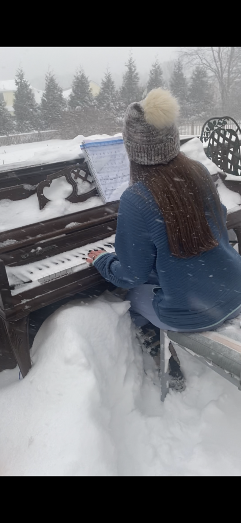 Playing Piano In The Snow in Attleboro