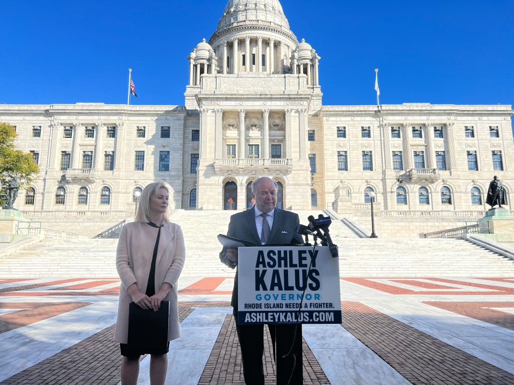 Ashley Kalus and former RI Supreme Court Justice speak at the State House steps on Wednesday, October 19, 2022