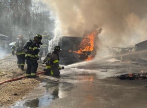 Firefighters battle large Tiverton garage fire | ABC6