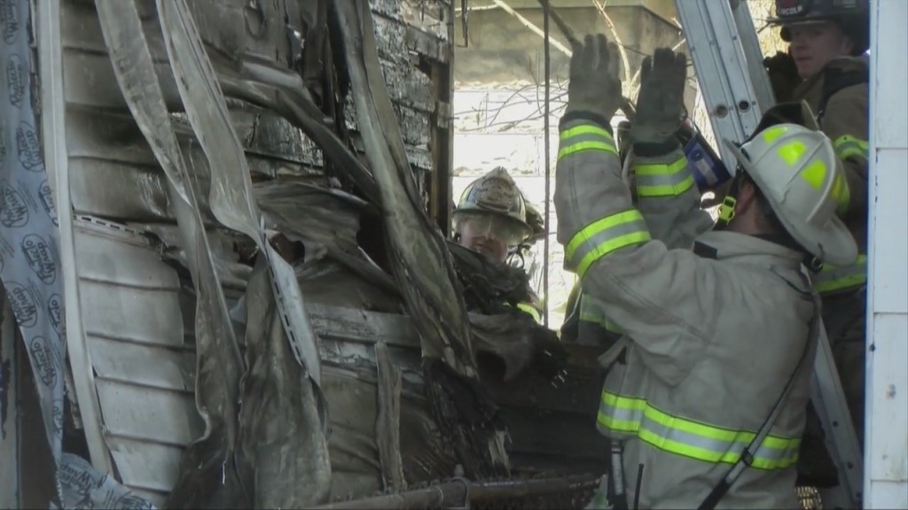 Firefighters Contain Flames From Spreading In Neighborhood Despite Strong Winds