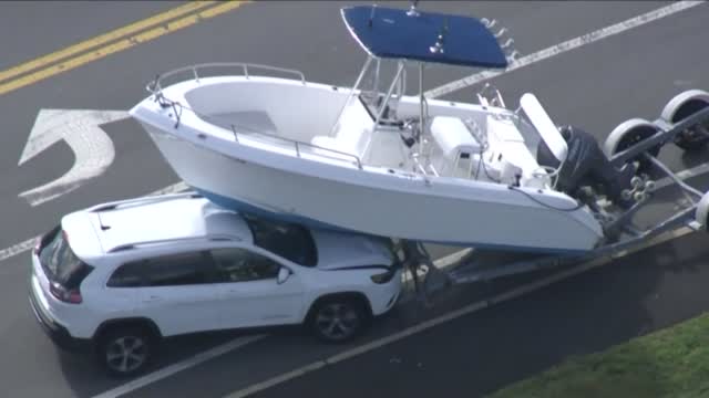 Boat Ends Up On Car