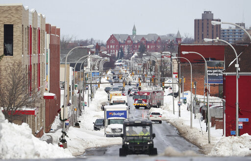 National Guard Checks Homes In Buffalo For Blizzard Victims