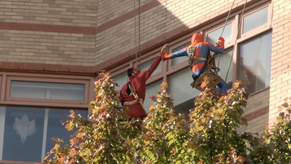 Window Washers Dress Up As Superheroes For Children's Hospital