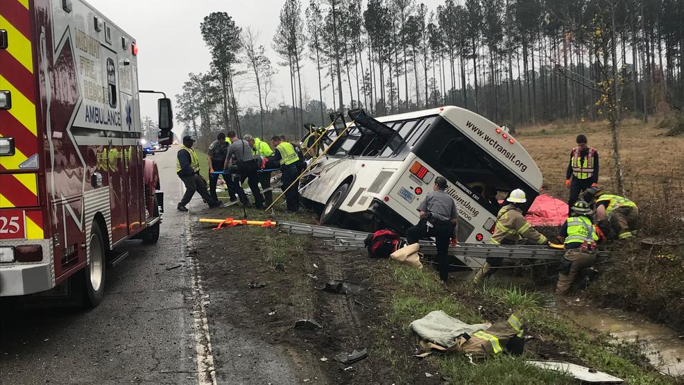 First responders on scene of bus vs car crash in