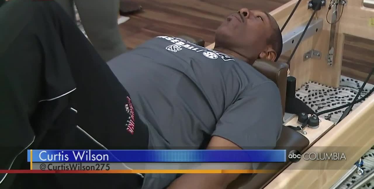 Curtis tries some Pilates exercises at RISE Fitness & Wellness Center!