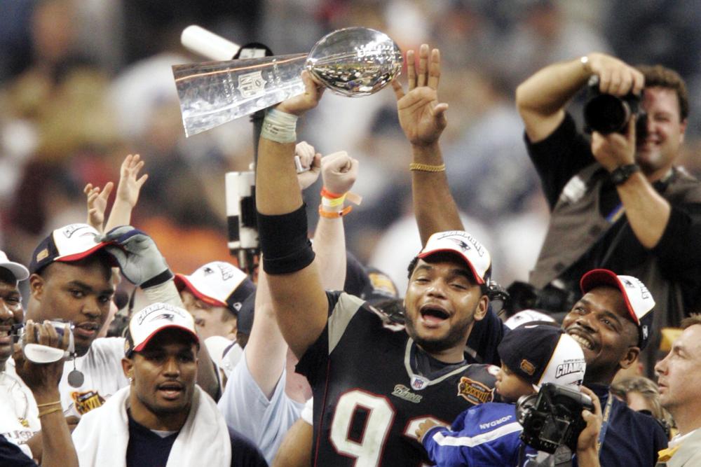 Richard Seymour Holding Up Lombardi Trophy With Patriots