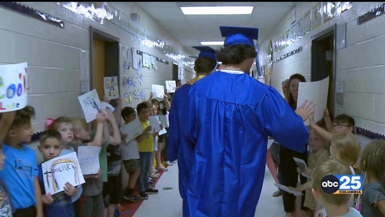 High school students participate in "Senior Walk" at Springdale