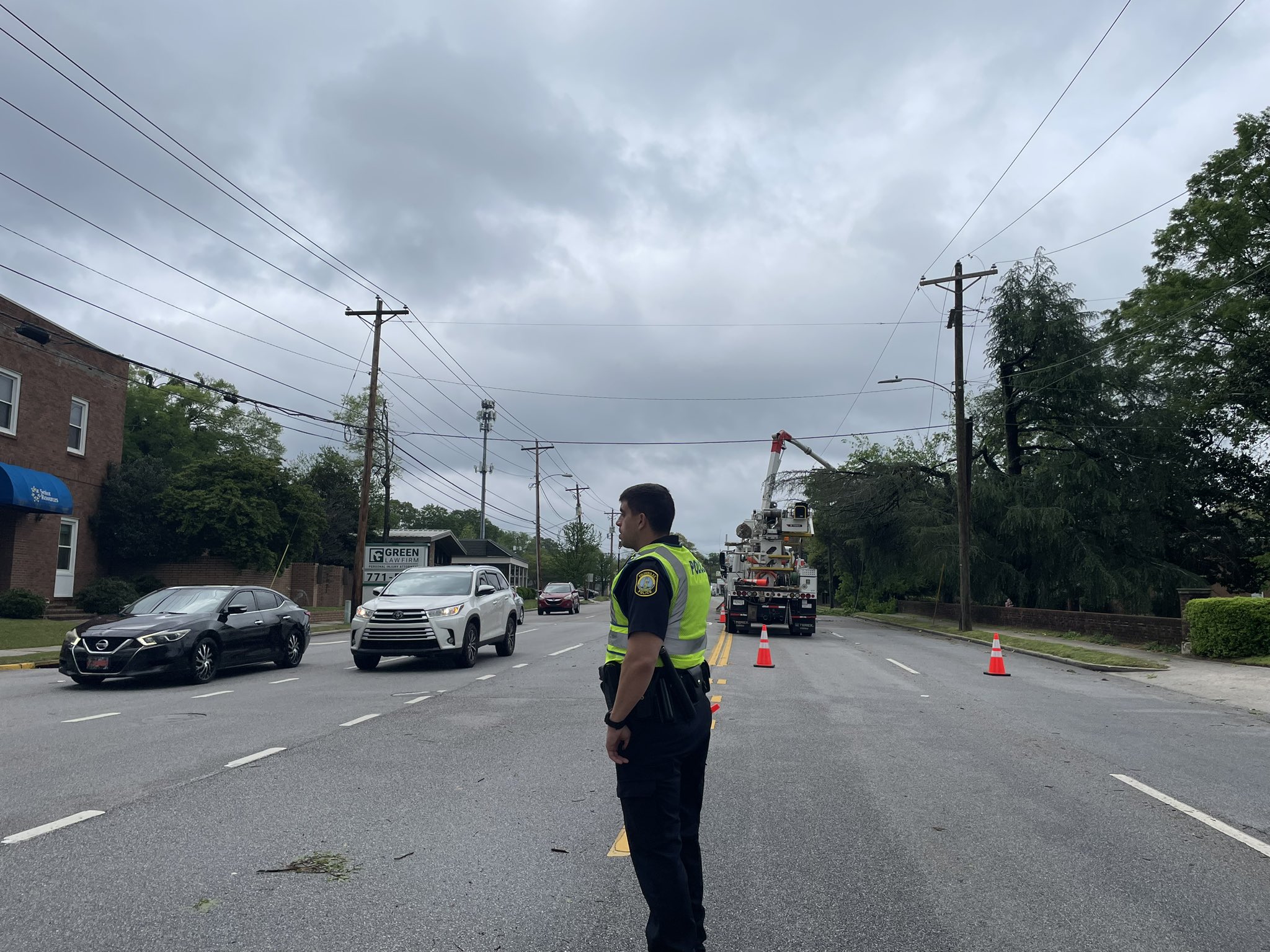 Traffic Alert Officers assisting traffic after light malfunction ABC