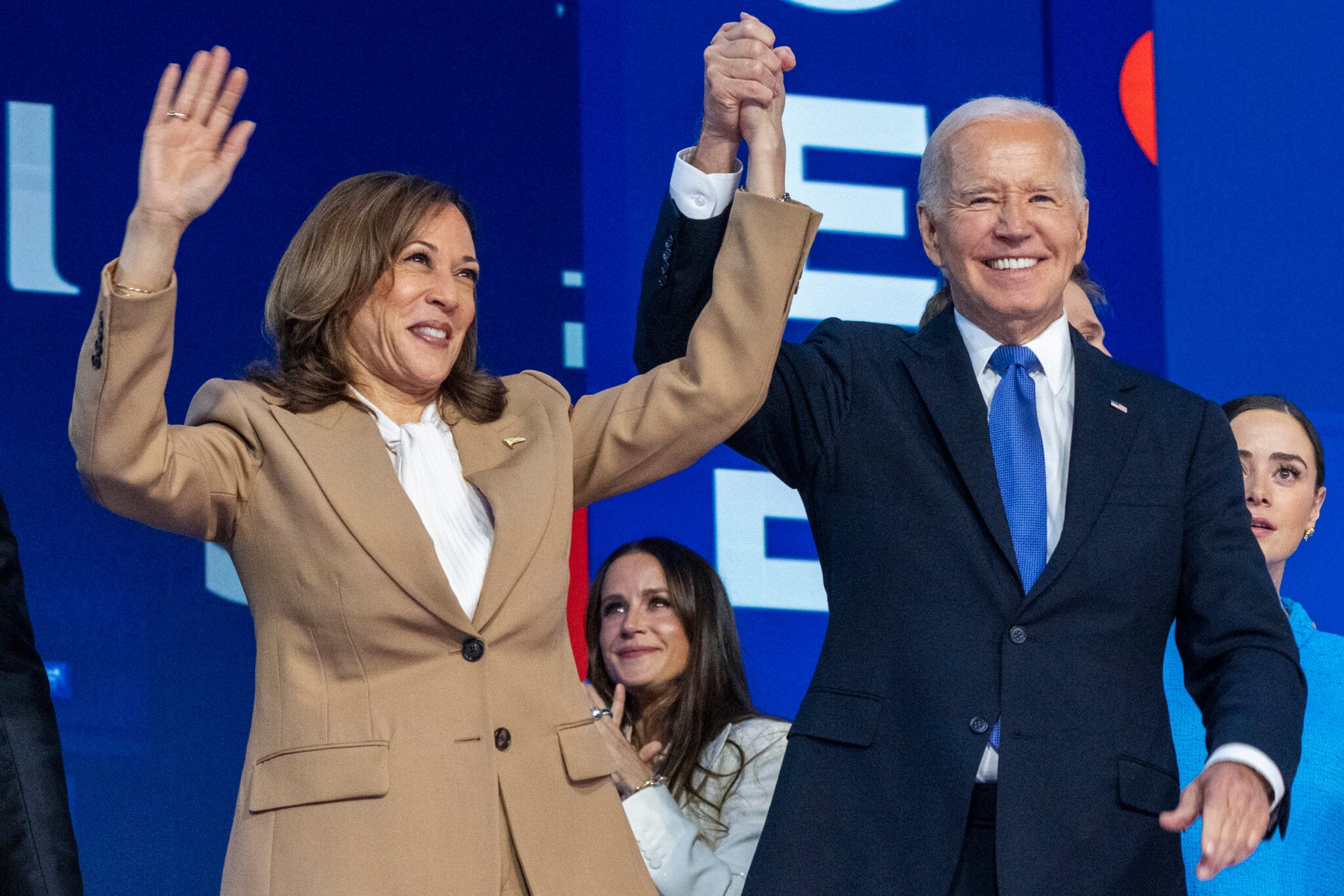 Biden gets a rousing ovation from Democrats as he gives Harris an