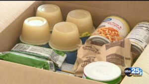 Local Law Enforcement Packs Boxes For Greg's Groceries