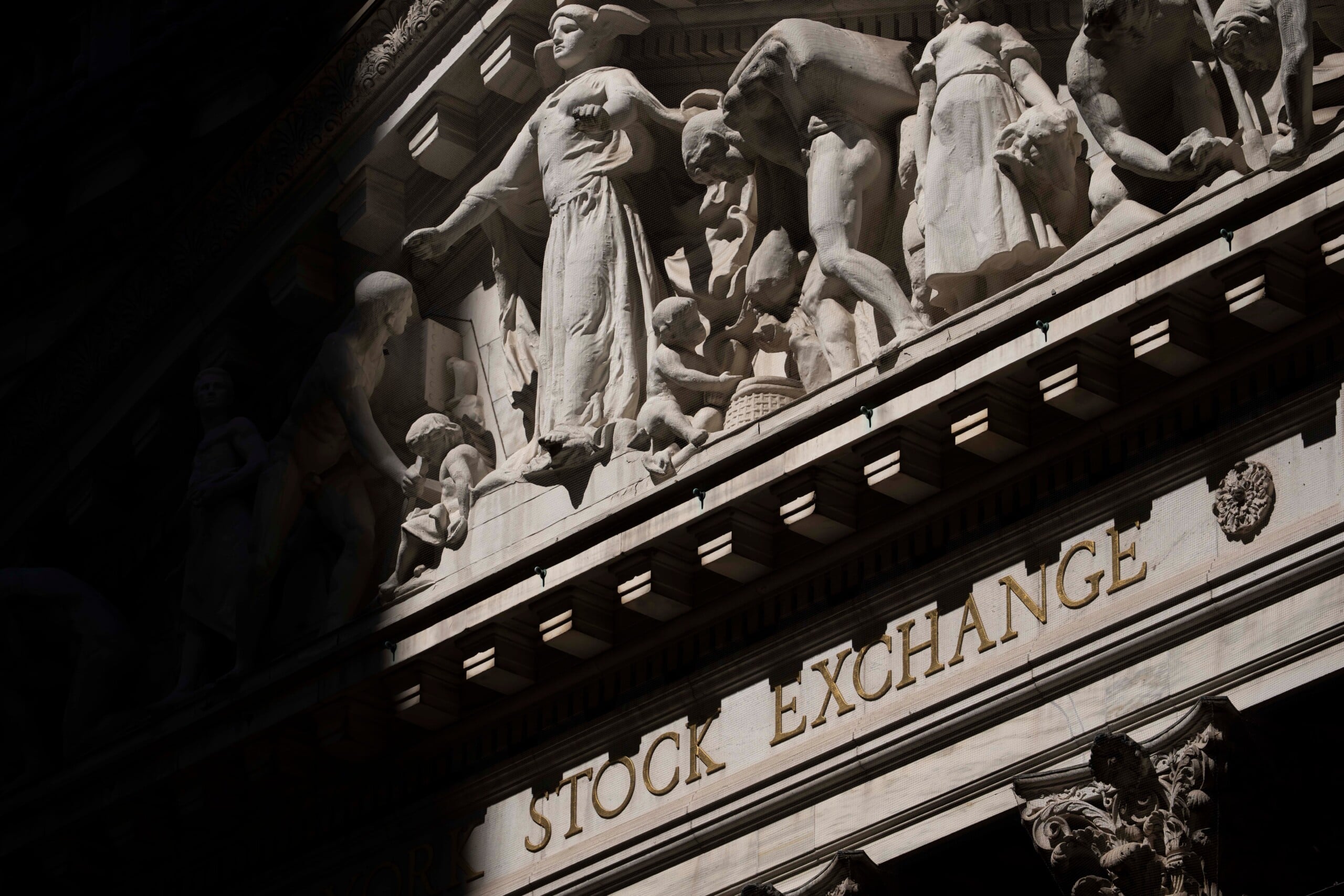 Wall Street hangs near its records