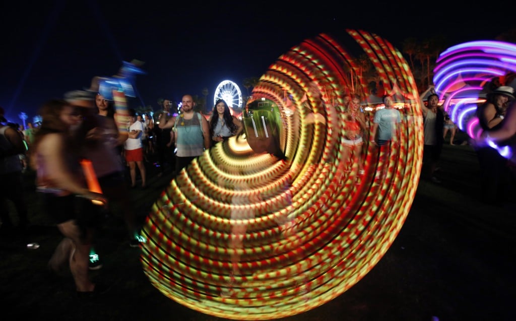 Concert Goer Uses Illuminated Hula Hoop During Performance By Canadian Electrofunk Duo Chromeo At Coachella Valley Music And Arts Festival In Indio, California