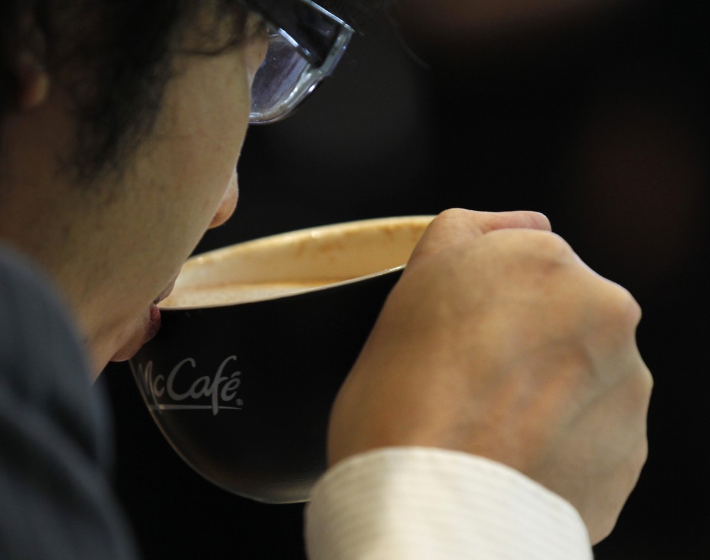 A Man Drinks Mcdonald's Mccafe Coffee At Its Harajuku Omotesando Shop In Tokyo