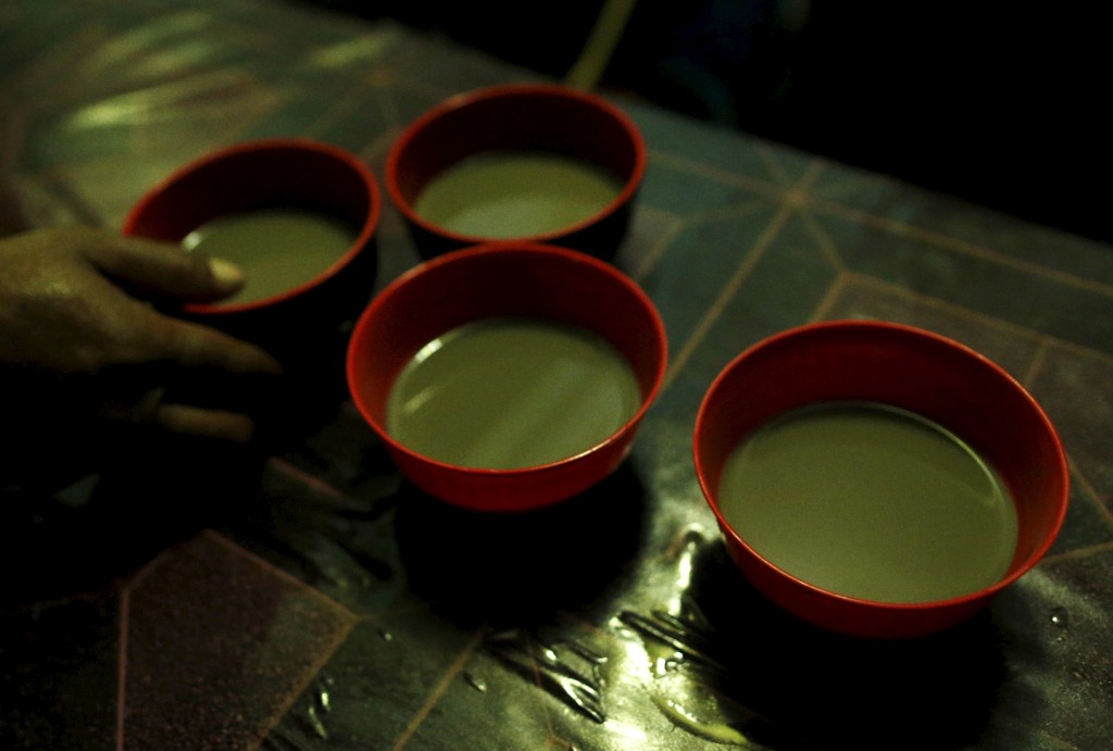 A Man Orders Four Bowls Of Kava At A Kava Bar Operating With Limited Electricity Days After Cyclone Pam In Port Vila