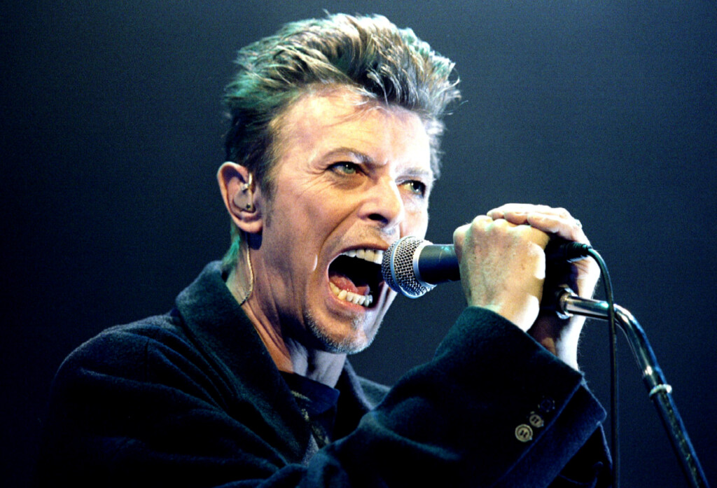 British Pop Star David Bowie Screams Into The Microphone As He Performs On Stage During His Concert In Vienna
