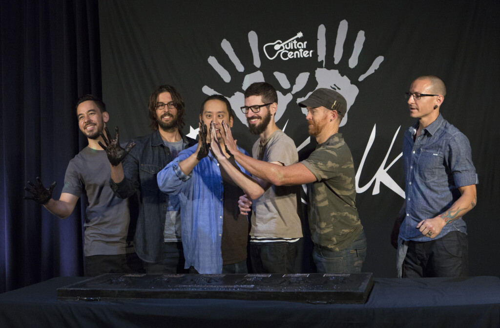 Members Of Rock Band Linkin Park Shinoda, Bourdon, Hahn, Delson, Farrell And Bennington Show Their Hands Covered In Cement As They Are Inducted Into Guitar Center's Rockwalk In Los Angeles