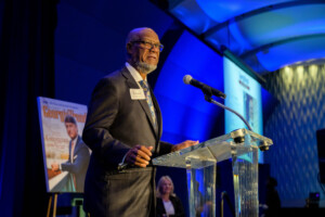 Hall of Inductee Calvin Smyre at podium speaking at the Georgia Aquarium Ocean's Ballroom
