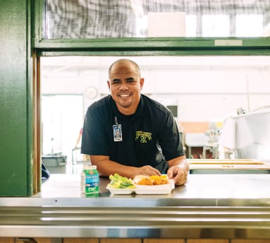 Rayburn Awaa Lincoln, Kaimuki High School’s cafeteria manager, says he asks himself this question every day: How can I make the food better within the nutritional guidelines, cost restraints and other parameters I’m locked into? Photo by Aaron K. Yoshino. 