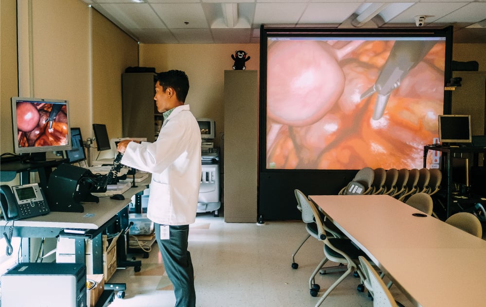Andrew Kinimaka, a student at UH’s John A. Burns School of Medicine, investigates an obstetric challenge using a virtual laparoscopic surgical trainer that reproduces the sense of touch. When tissue is grasped and cut, the surgeon feels the pressure, response and vibration of the action – as if the surgeon were actually inside a human body.