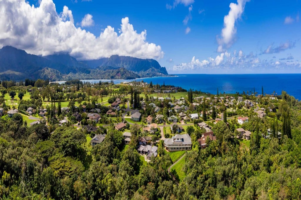 An aerial view of Princeville and Hanalei Bay on Kaua‘i’s North Shore. At least eight homes on Kauaʻi’s North Shore each sold for more than $20 million during 2021. | Photo: Getty Images