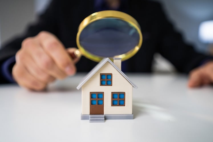 Magnifying Glass And Small House