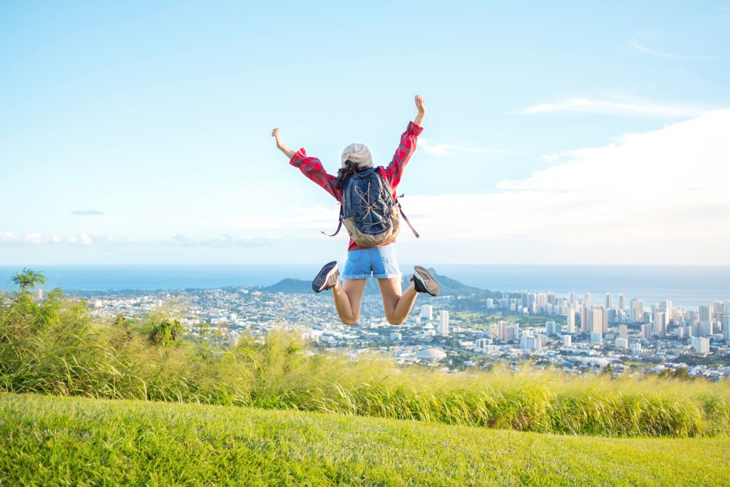 Hiking And Jumping On Mountain