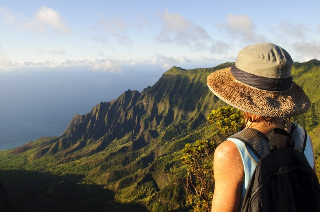 Woman Outdoors Looking At Dramatic View And Future On Kauai