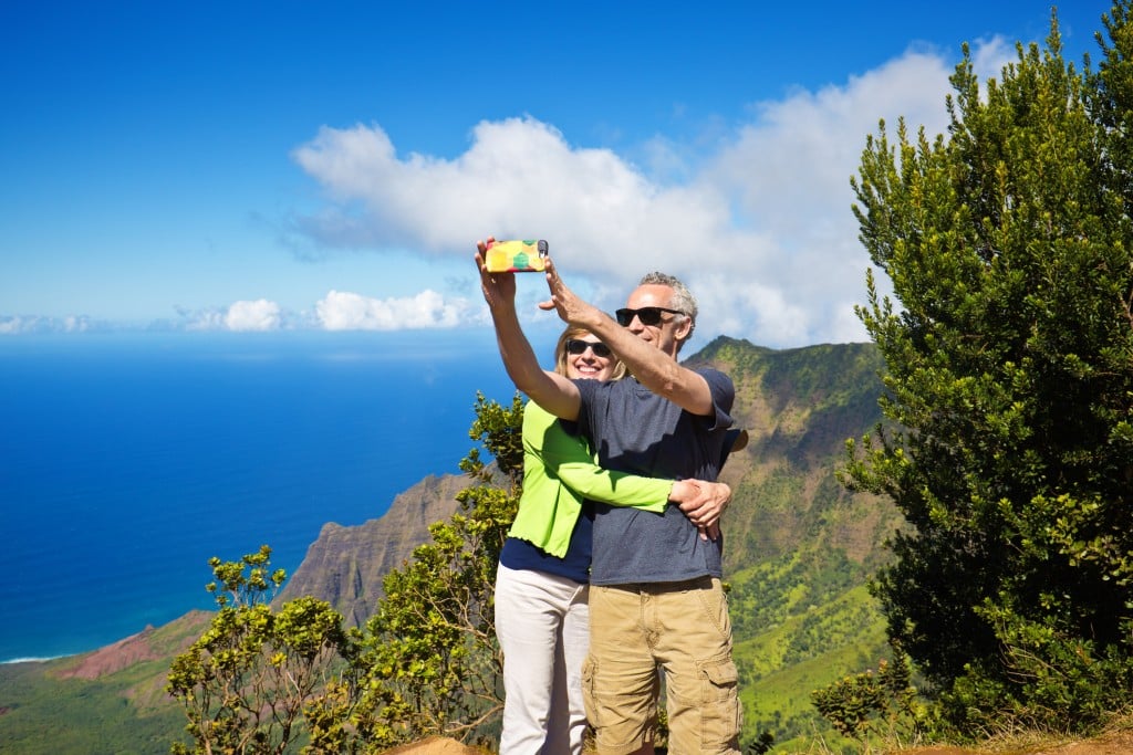 Selfie Tourist Couple At Waimea Canyon State Park Kalalau Beach, Kauai, Hawaii