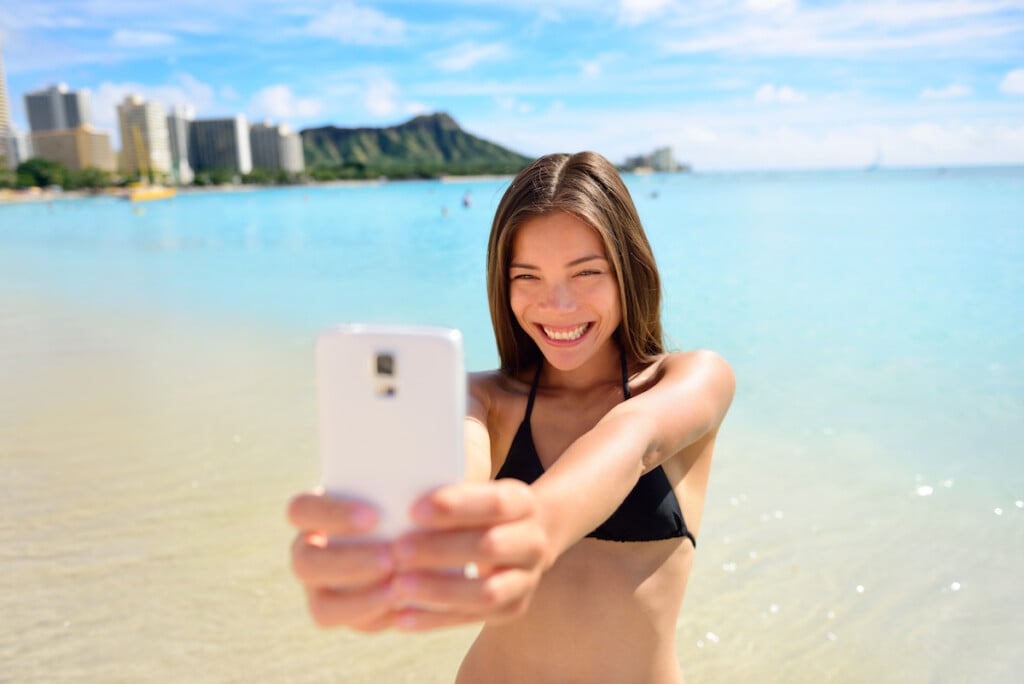 Girl Taking Fun Smartphone Selfie On Waikiki Beach
