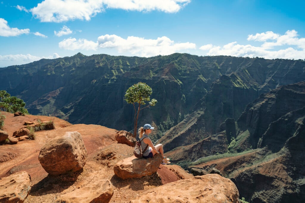 Woman On Waipo'o Falls Via Pu'u Hinahhina And Canyon Trail Koke'e State Park Kauai Hawaii Usa