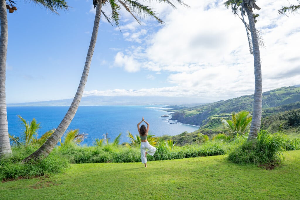 Young Woman Practices Yoga At Coastal Overlook