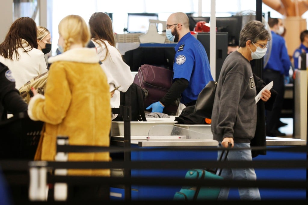 Passengers Travel Through Logan Airport In Boston
