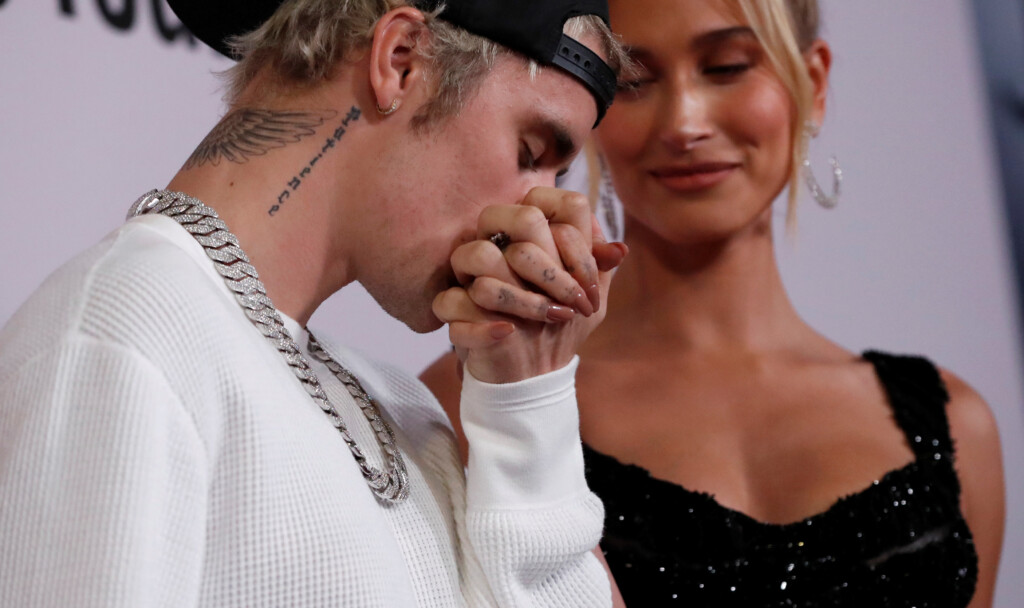 Singer Bieber Kisses The Hand Of His Wife Hailey Baldwin At The Premiere For The Documentary Television Series "justin Bieber: Seasons" In Los Angeles