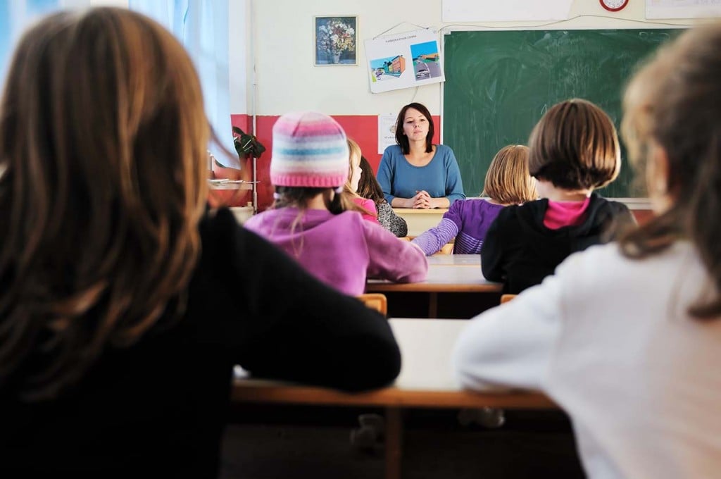 teacher in school classroom (Source: Storyblocks)