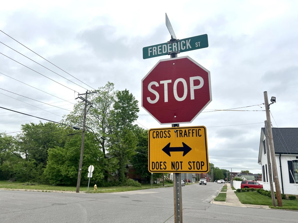 New four way stop signs to places at Themis and North Frederick street