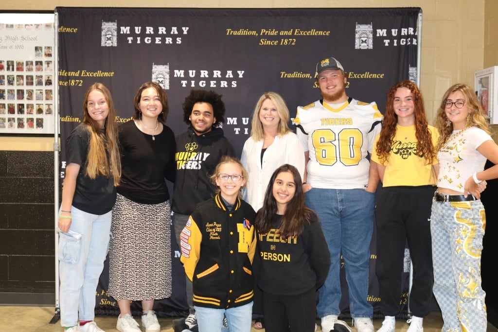 Ann Samons, center, celebrates with Murray High School students after learning she has been named the 2022 Kentucky High School Counselor of the Year. (Source: Murray Independent School District)