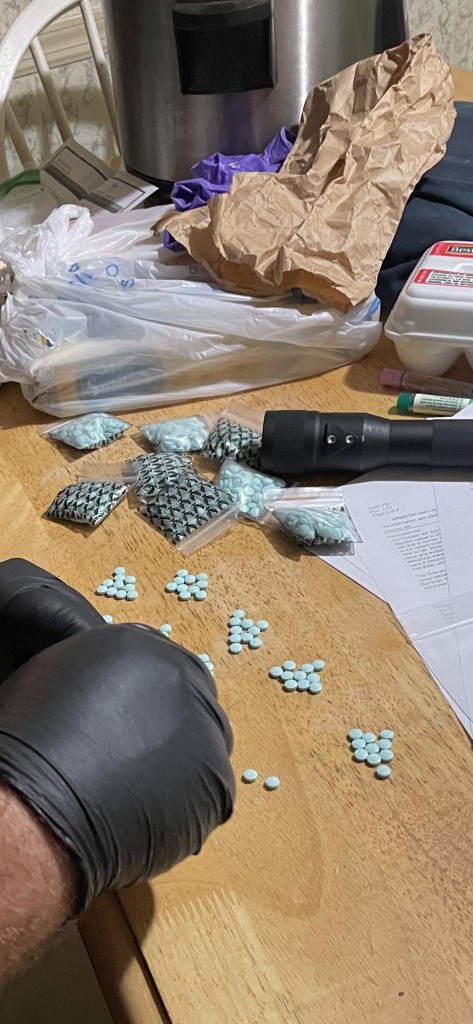 This photo was taken around 11:45 p.m. Tuesday, Oct. 4 in Carlisle County as one of several locations searched. Carlisle County Sheriff Gilbert counted these deadly pills. A presumptive tests revealed the presence of Fentanyl. (Source: Graves County Sheriff's Office)